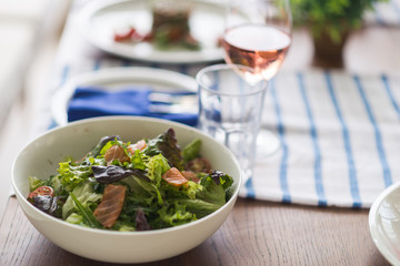 Restaurant table set with glasses, napkins and cutlery