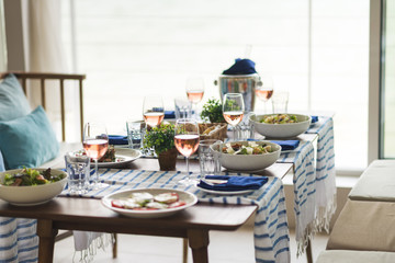 Restaurant table set with glasses, napkins and cutlery