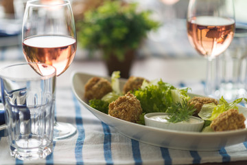 Restaurant table set with glasses, napkins and cutlery