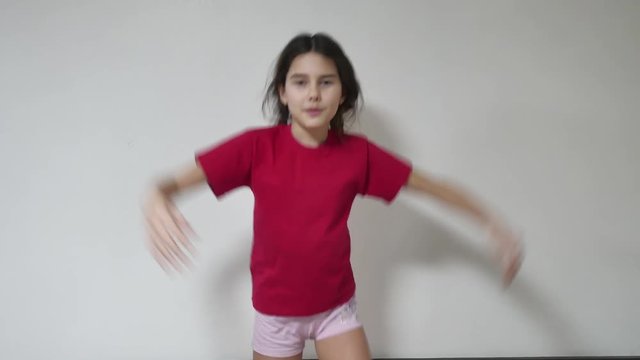 girl kid dances hip hop, girl child dancer indoor break dance