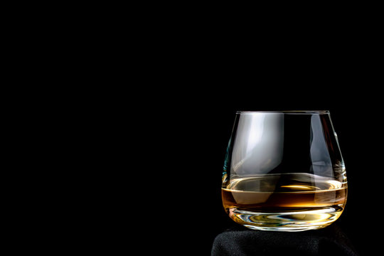 The glass of cognac or brandy.
