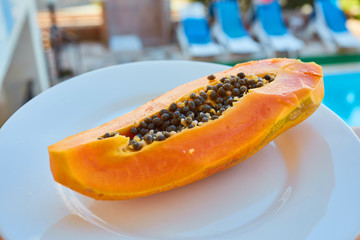 papaya fruit half and cut pieces