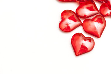 Red love hearts on a plain white background