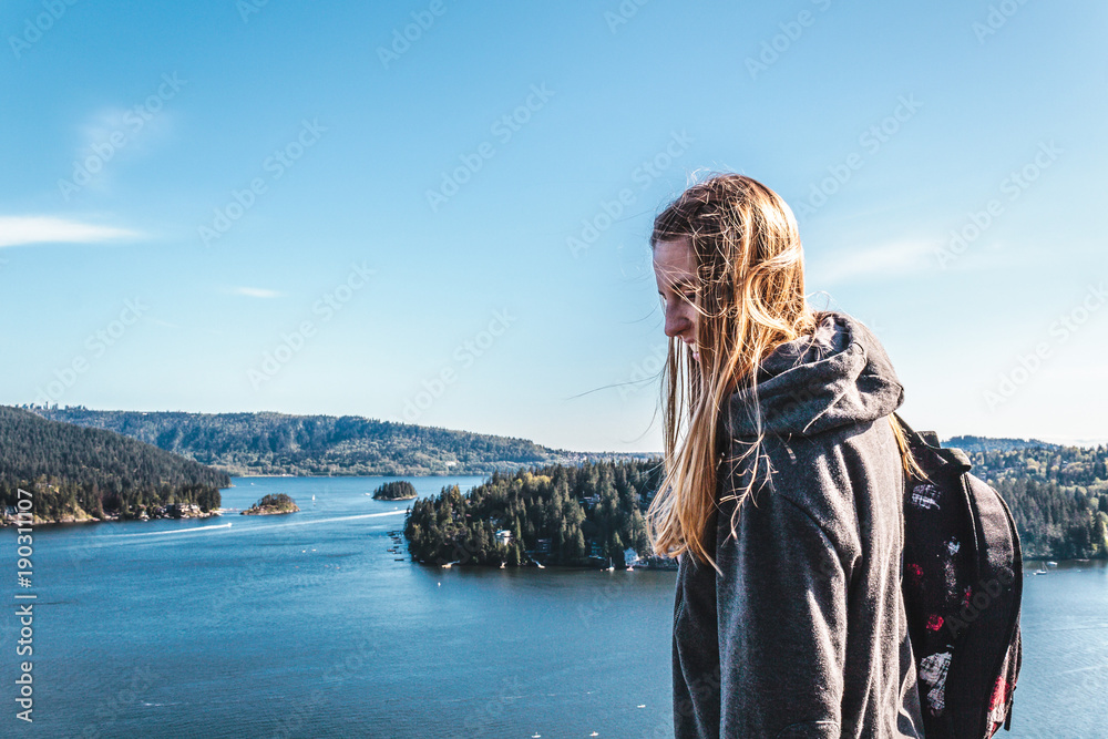 Sticker backpacker girl on top of quarry rock at north vancouver, bc, canada