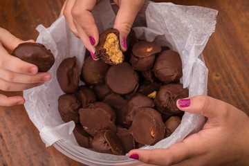 Girls Eating Chocolate Peanut Butter Candies