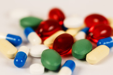 Medical Backgrounds./ Pills and tablets colorful close up on white 