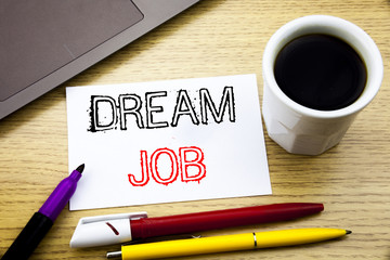 Handwritten text caption showing Dream Job. Business concept writing for Dreaming about Employment Job Position written on notebook book on the wooden background in the Office with laptop coffee
