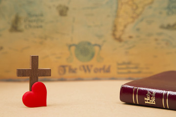 For God so loved the world - A Cross on a rustic world map