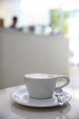 ccappuccino or Latte art coffee made from milk on the white table in coffee shop