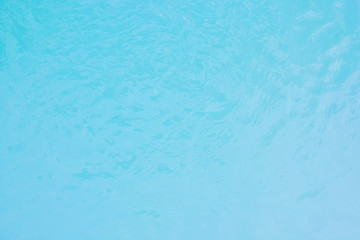 The image of the water in the blue swimming pool is suitable for use as a background and a background.