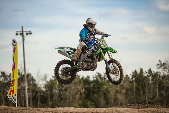 Motocross Racer Jumps Over Finish Line 