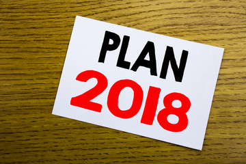 Plan 2018. Business concept for Planning Strategy Action Plan written on sticky note, wooden wood background with copy space.