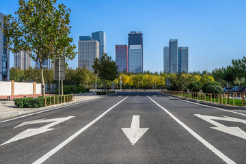 city road through modern buildings in beijing.