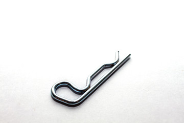 A lock nut split pin or cotter pin for ensure any connection on white background