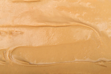 Cashew butter spread on bread across entire frame showing only the cashew butter. Cashews are a...