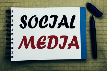 Social Media. Business concept for Community Social Media Written on notepad note paper background with space office view with pencil marker