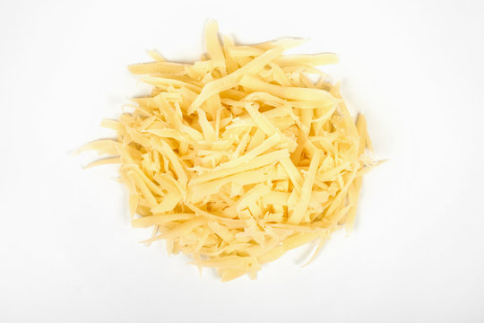 Heap of grated cheese, isolated on white background.