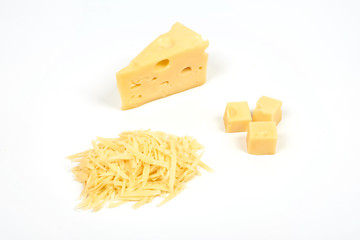 piece of cheese and heap of grated cheese, isolated on white background.