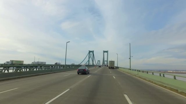 day POV driving onto Delaware Memorial Bridge towards Philadelphia