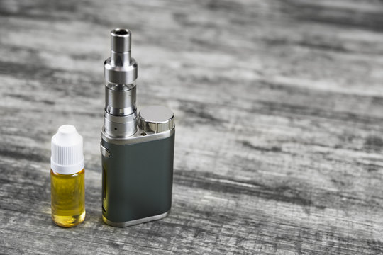 E - cigarette for vaping , technical devices.The liquid in the bottle