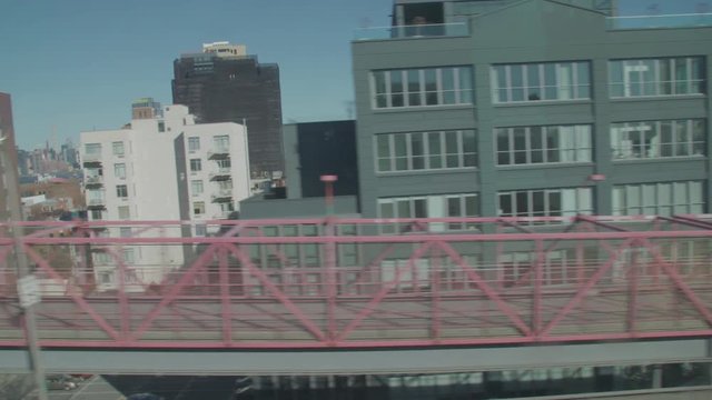 shot from the JMZ train riding the Williamsburg bridge overlooking at brooklyn side and williamsburg.