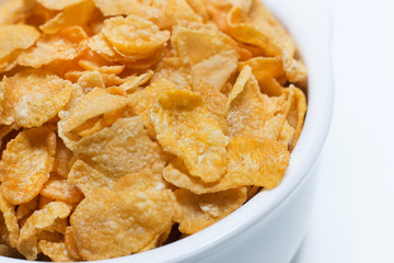  image  Close up Cornflakes cereal breakfast in white bowl on white background.
