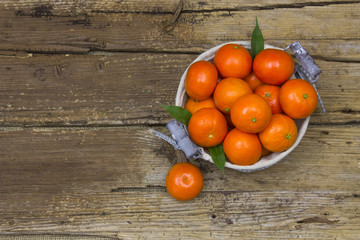 Naklejka na ściany i meble fresh tangerines in a basket
