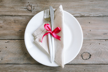 Table setting with red ribbon