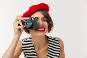 Portrait of a smiling woman wearing red beret