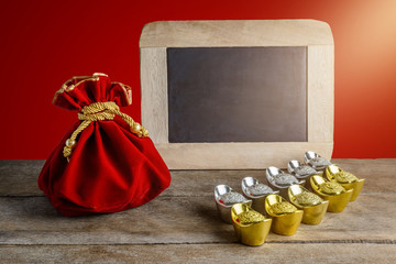 Chinese New Year Red fabric bag, ang pow and chalkboard with Chinese money of luck and Shoe-shaped...