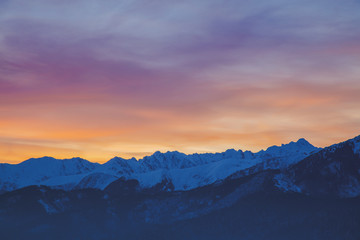 Fototapeta na wymiar Sunrise over snow Tatry mountains in winter time.