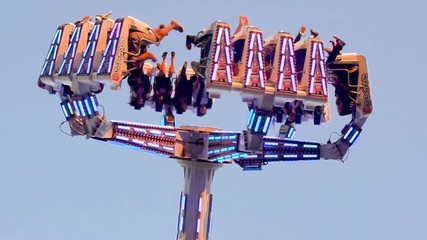 Under a pendulum ride at an amusement park with a speed ramp