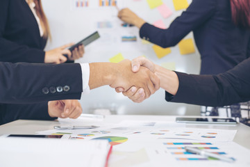 close up hand of business  people shaking hands finishing up meeting showing unity , business teamwork concept