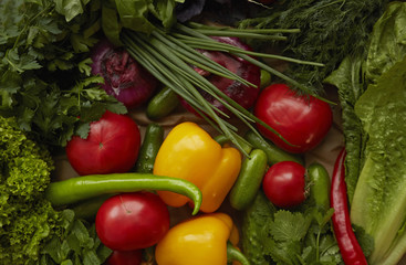 Obraz na płótnie Canvas Different raw vegetables on craft paper background. Healthy nutrition.