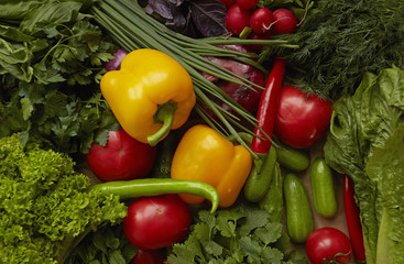 Different raw vegetables on craft paper background. Healthy nutrition.