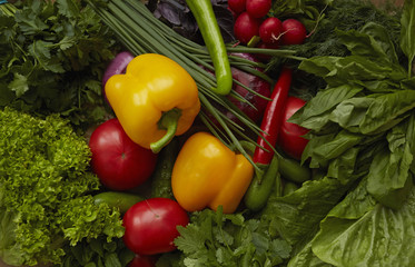 Different raw vegetables on craft paper background. Healthy nutrition.