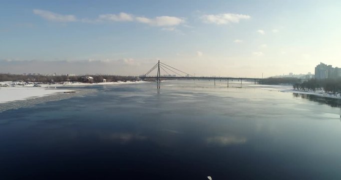 Landscape with suspension Moscow Bridge across the Dnieper river, Obolon, Kiev, Ukraine