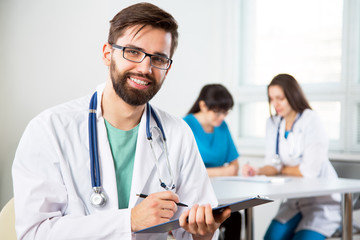 Portrait of a young doctor in a clinic