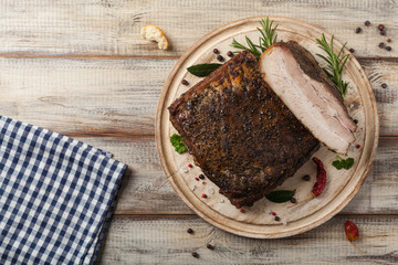 Baked whole pork bacon.