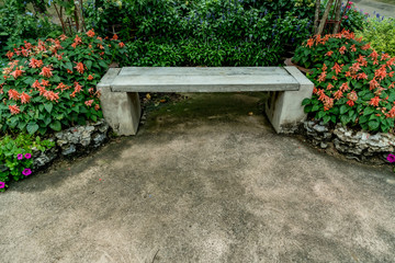 Fototapeta na wymiar Concrete bench in the park