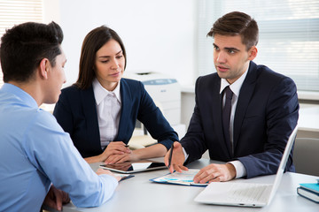 Businessman tells his colleagues about a new project