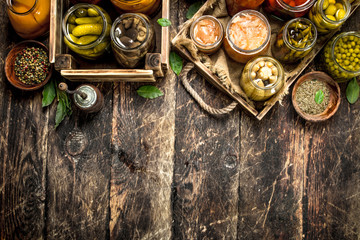 Preserves food with vegetables and mushrooms on an old tray.