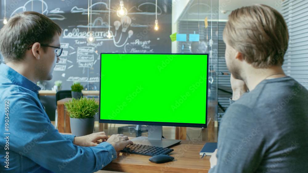 Poster two office employees have project related discussion, on the desk stands personal computer with mock