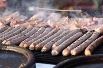 Pile of homemade raw sausages. Hot dog sausages prepared for grill. Fast food outside.  Diet and calories. Health. 