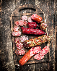 Different kinds of salami on the boards.