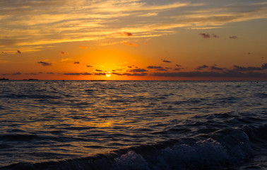 Amazing sea sunset, the sun, waves, clouds