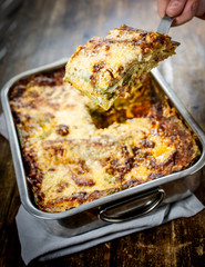 Lasagna bolognese. Typical homemade fresh green pasta cooked in oven.
