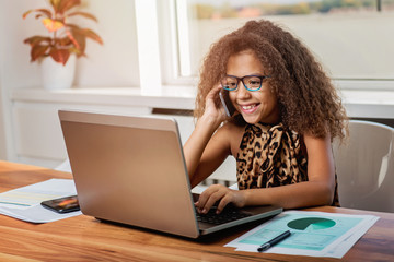 Cute girl working on a laptop