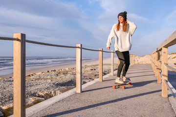 Girl riding a skateboard © homydesign