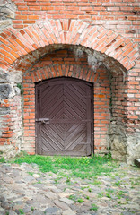 Fototapeta na wymiar Single Wooden Door in Old City Wall